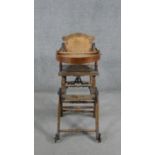 A late 19th century carved beech child's high chair converting to baby walker. H.87 W.39 D.61cm