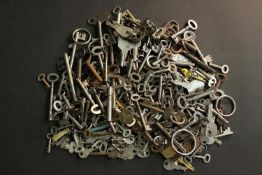 A large collection of vintage and antique keys and key labels.