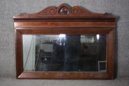 A Victorian carved walnut framed overmantel mirror. H.94 W.120cm.