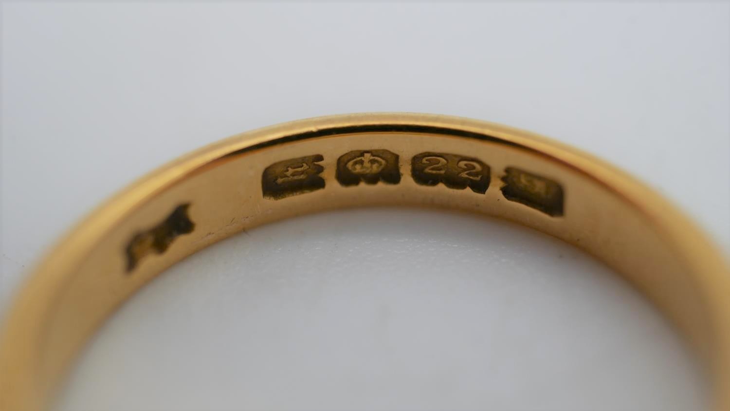A 1920's 22 carat yellow gold D-shaped court wedding band. Hallmarked: London, 1925. Size N 1/2. - Image 5 of 6