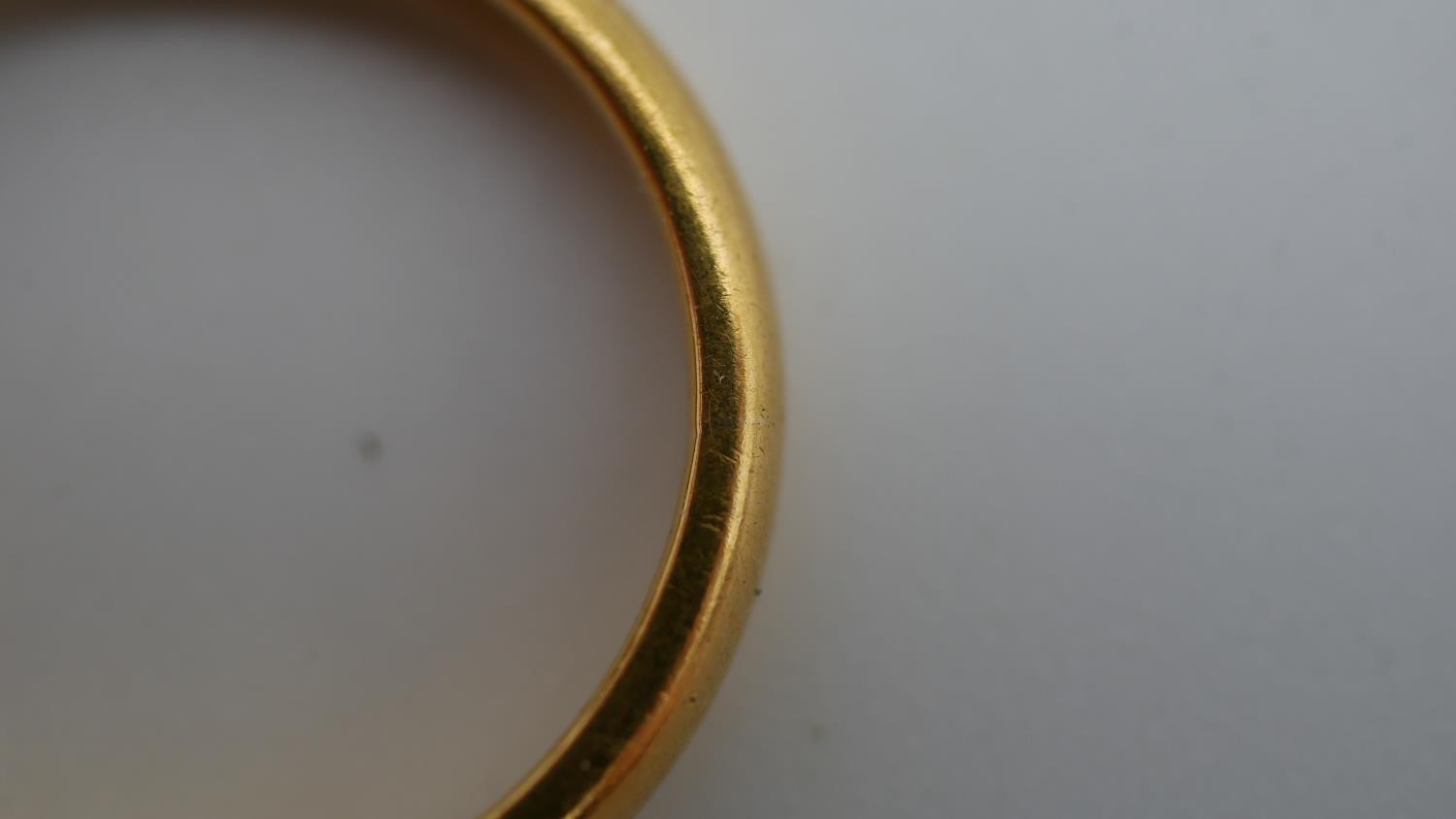 A 1920's 22 carat yellow gold D-shaped court wedding band. Hallmarked: London, 1925. Size N 1/2. - Image 4 of 6