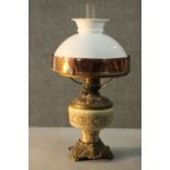 A Swedish copper and brass oil lamp with ceramic body and milk glass shade. H.54 Dia.26cm.