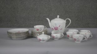 A six person Schumann Bavarian fine china floral design tea set. Makers mark to the base. (21