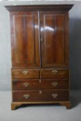 A Georgian mahogany linen press fitted with slides above drawers on bracket feet. H.224 W.112 D.60cm