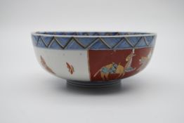 A 19th century Japanese Imari ceramic footed bowl. Decorated with peaches, flowers, birds and a