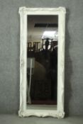 A dressing mirror in painted Rococo style frame. H.60 W.127 cm.