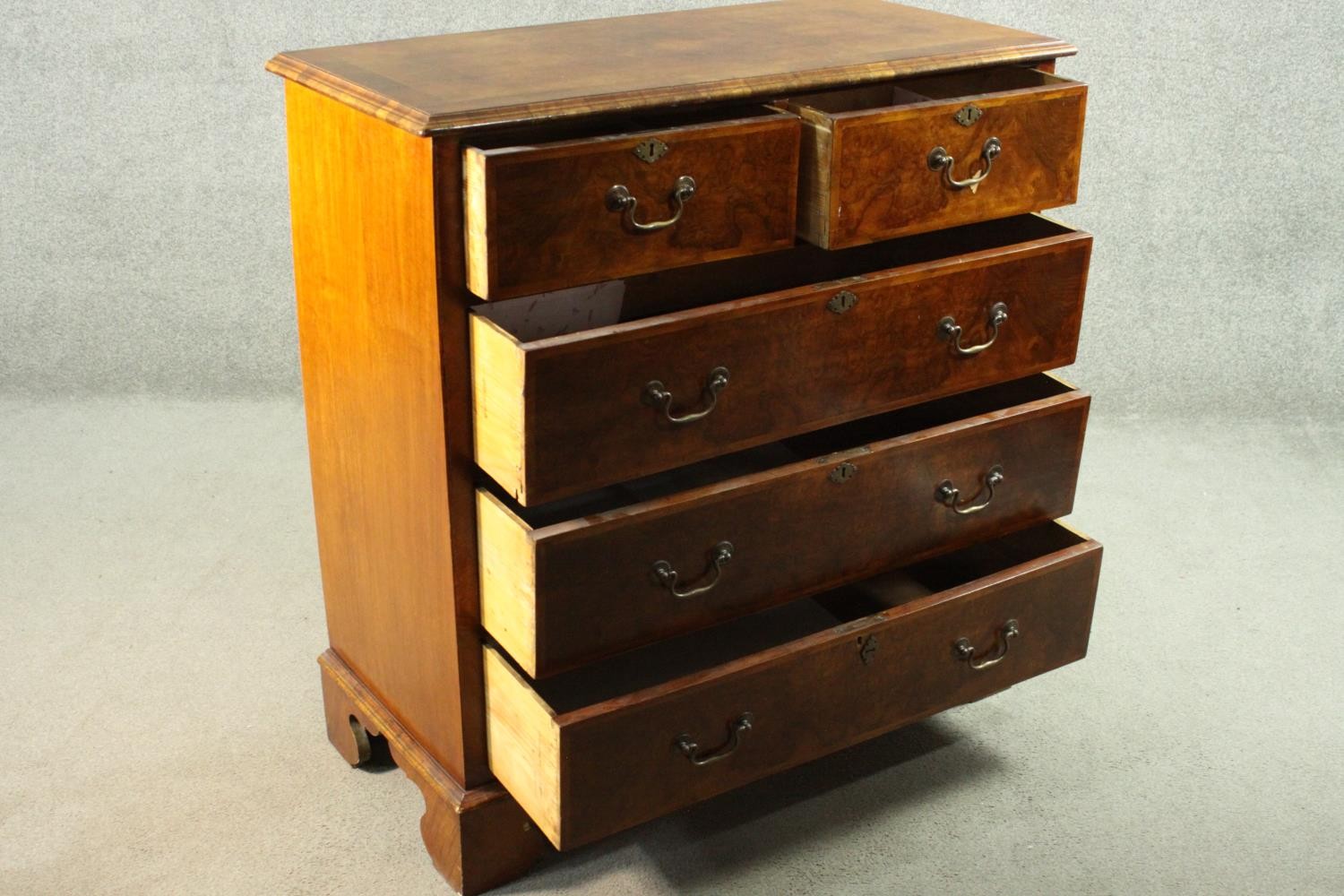 A 19th century early Georgian style walnut, crossbanded and featherbanded chest of drawers with - Image 5 of 8