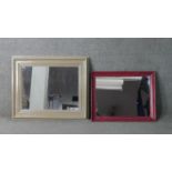 Two contemporary framed wall mirrors, one with a cream painted frame. H.70 W.85cm (largest)