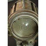 A vintage Mole-Richardson theatre spotlight and hinged wall bracket. Relief makers mark. H.20 Dia.