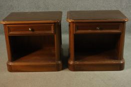 A pair of oak bedside cabinets. H.56 W.60cm.