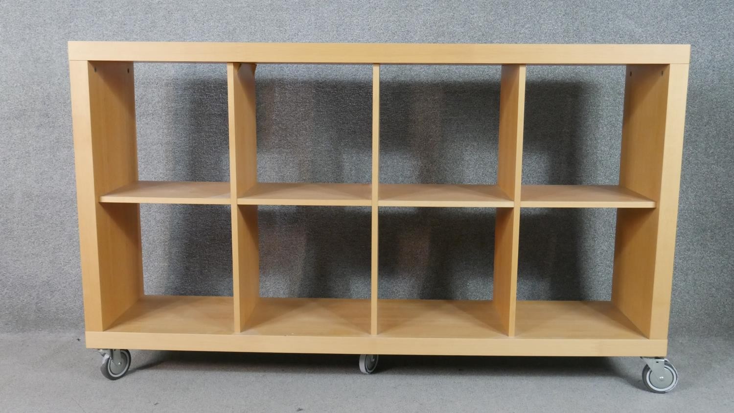 Bookcase, contemporary open shelves on wheeled casters. H.97 W.162 D.36cm
