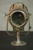 A vintage Mole-Richardson theatre spotlight and hinged wall bracket. Relief makers mark. H.20 Dia.