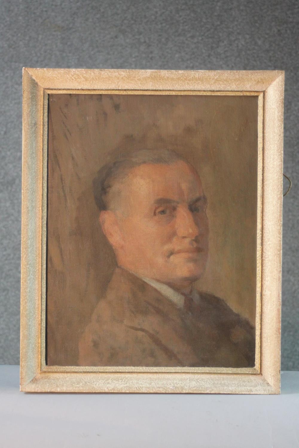 A framed mid century oil on canvas portrait of a gentleman in a brown jacket. Unsigned. H.53 W.42cm. - Image 2 of 5