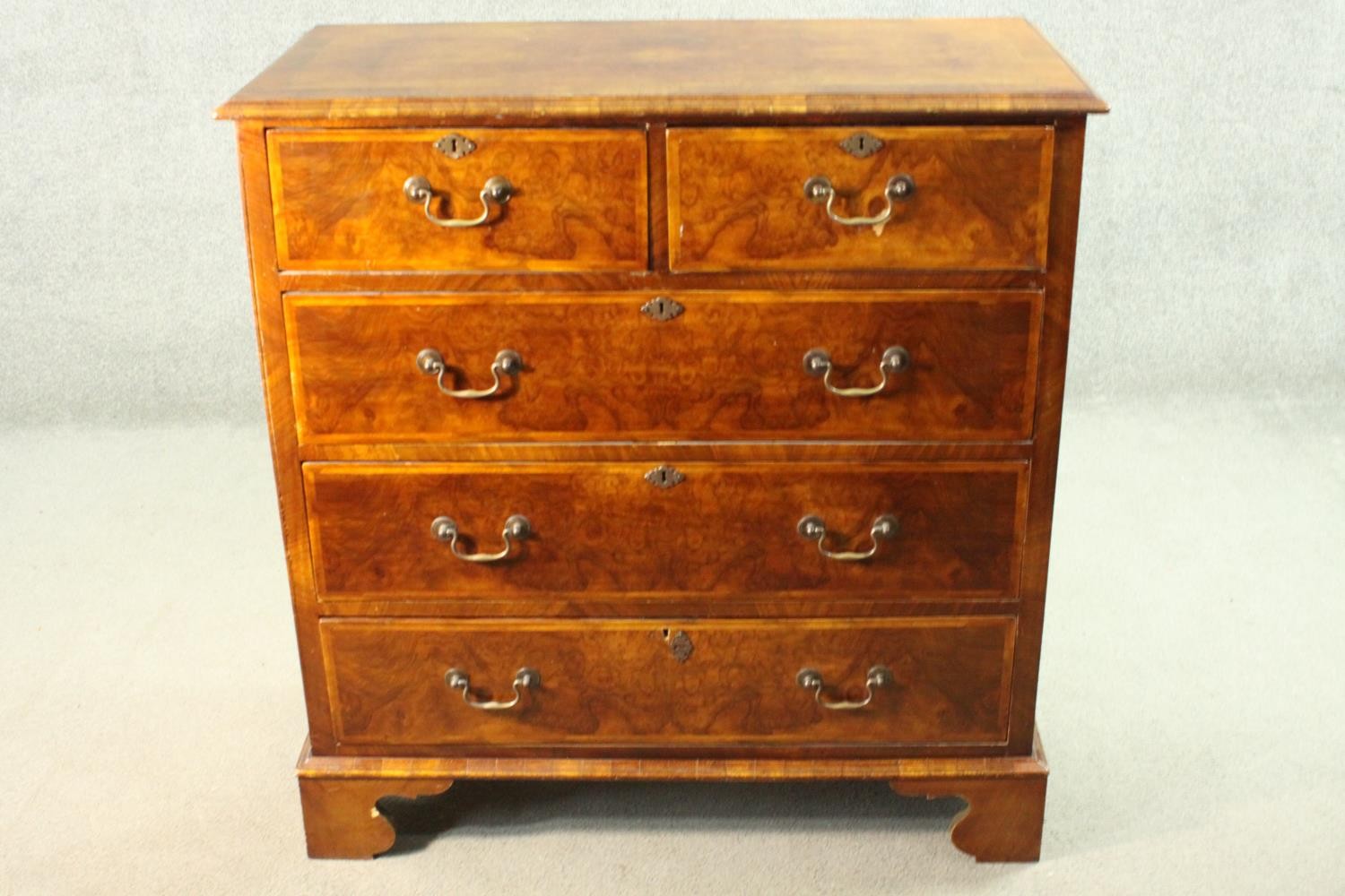 A 19th century early Georgian style walnut, crossbanded and featherbanded chest of drawers with - Image 3 of 8