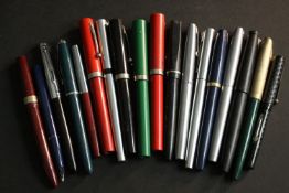 A collection of eighteen vintage fountain pens, makers include Parker, Sheaffer and Platignum.