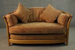 A vintage light elm Ercol Renaissance sofa with maker's label.