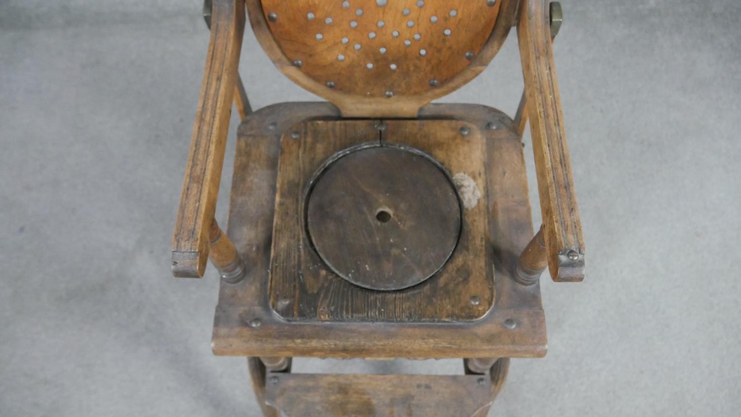 A late 19th century carved beech child's high chair converting to baby walker. H.87 W.39 D.61cm - Image 6 of 8