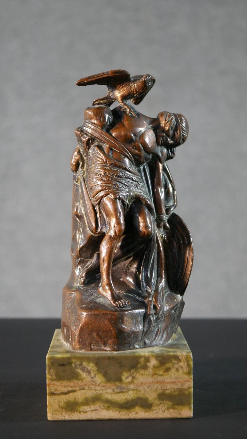 A small copper figure group of 'The Dying Cuchulainn by Oliver Sheppard. Commemorative plaque to the