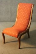 A 19th century mahogany framed nursing chair along with a 19th century footstool on cabriole