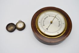 An Edwardian mahogany and satinwood inlaid barometer with silvered dial along with a cased pocket
