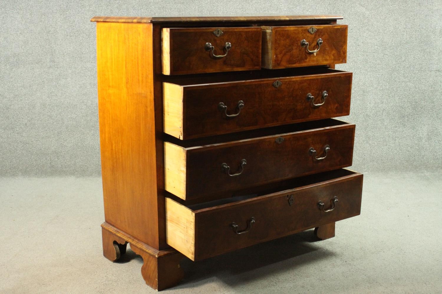 A 19th century early Georgian style walnut, crossbanded and featherbanded chest of drawers with - Image 6 of 8