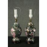 A pair of Oriental style rose design ceramic lustre urn vases converted to table lamps. Each sitting