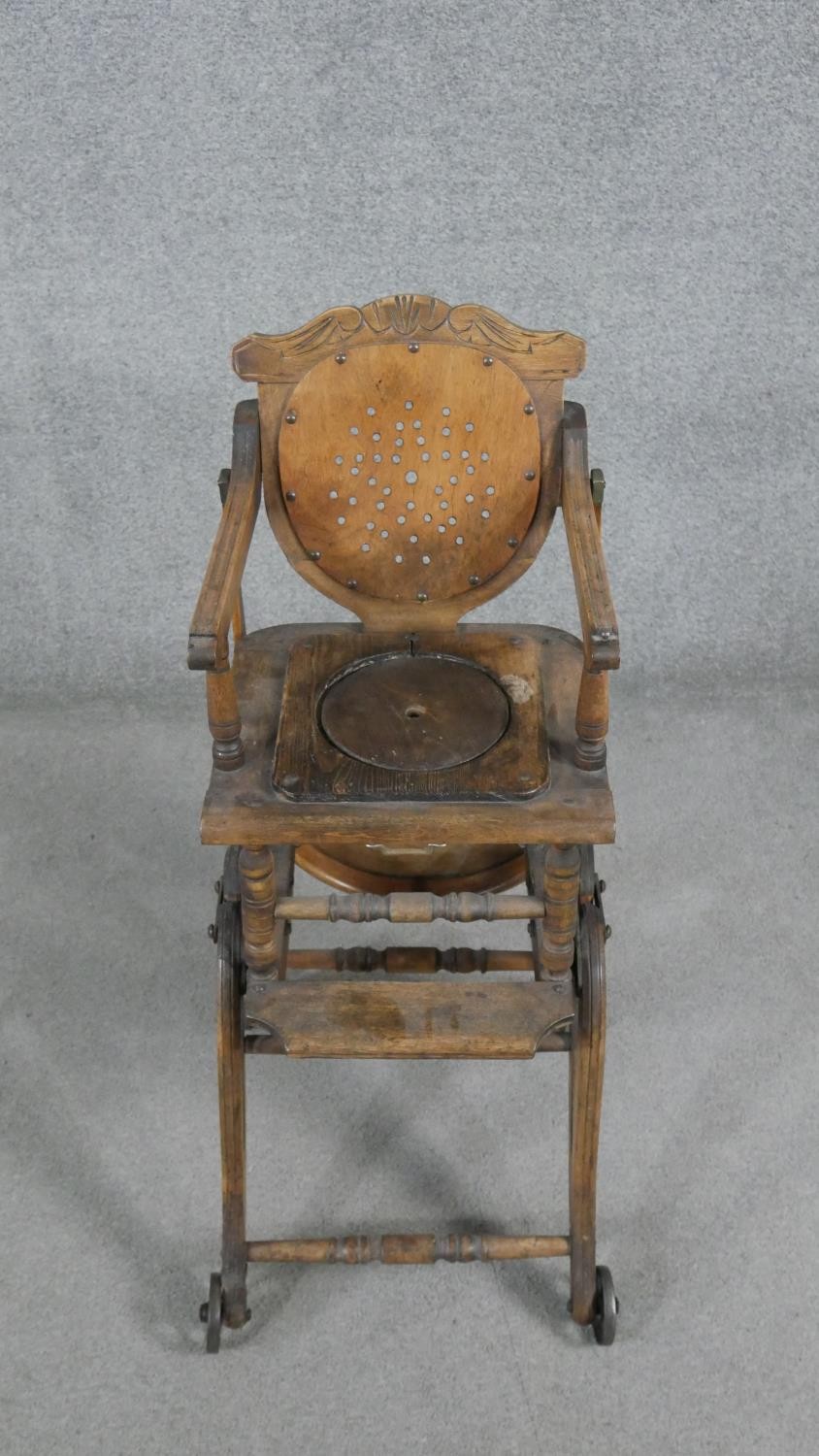 A late 19th century carved beech child's high chair converting to baby walker. H.87 W.39 D.61cm - Image 2 of 8