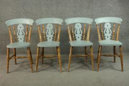 A set of four 19th century painted and pitch pine bar back dining chairs.