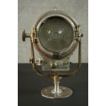 A vintage Mole-Richardson theatre spotlight and hinged wall bracket. Relief makers mark. H.20 Dia.