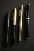 Four vintage fountain pens, makers including Parker.