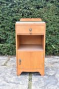 A mid century light oak Art Deco style pot cupboard. H.67 W.35 D.37cm