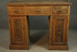 Pedestal desk, Victorian carved oak in three sections. H.77 W.103 W.48cm.