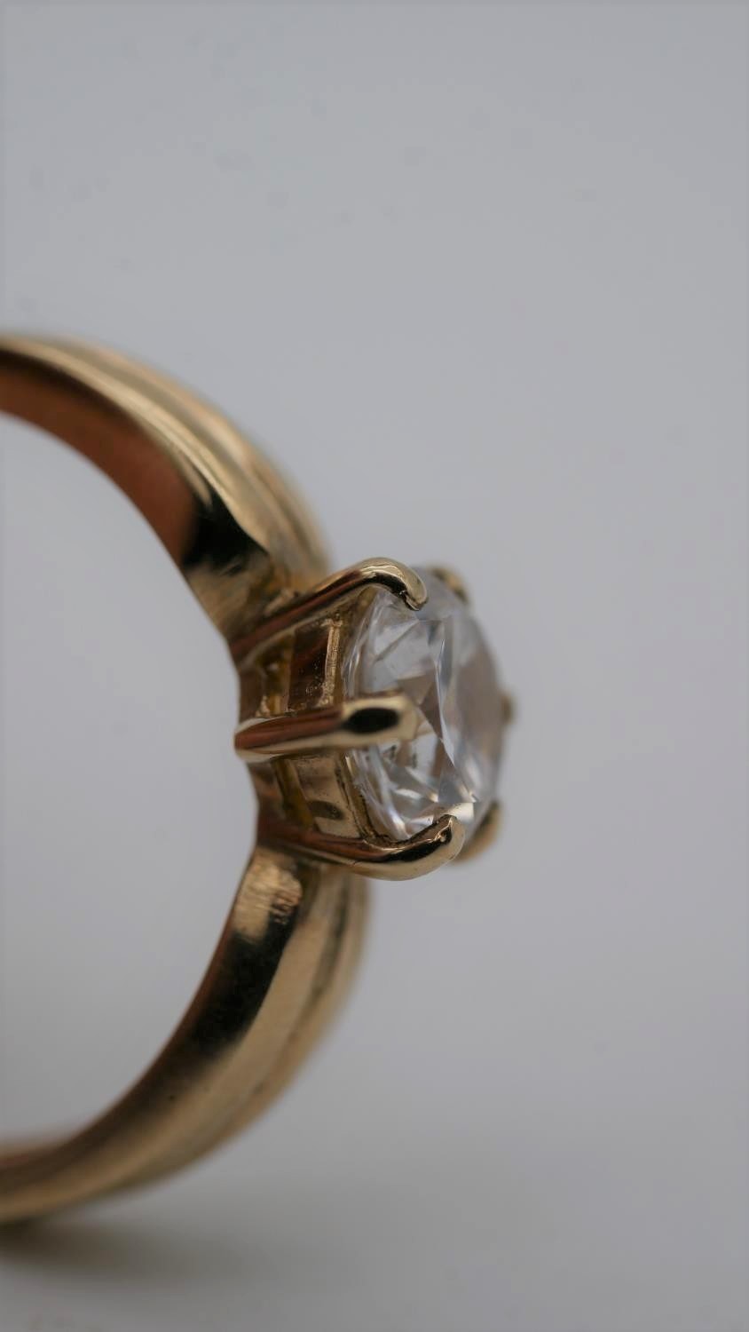 A cubic zirconia and 9 carat gold solitaire ring. Set to centre with a round brilliant cut cubic - Image 6 of 7