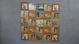 A wall hanging with various vintage advertisement posters. H.148 W.148cm