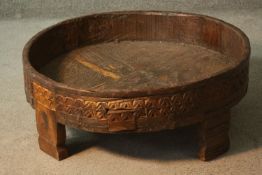 A large tribal hardwood bowl with geometric design on four rectangular feet. H.24 Dia.69cm.