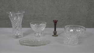 A collection of cut crystal and glass including vases, bowls, a dressing table tray and a bohemian