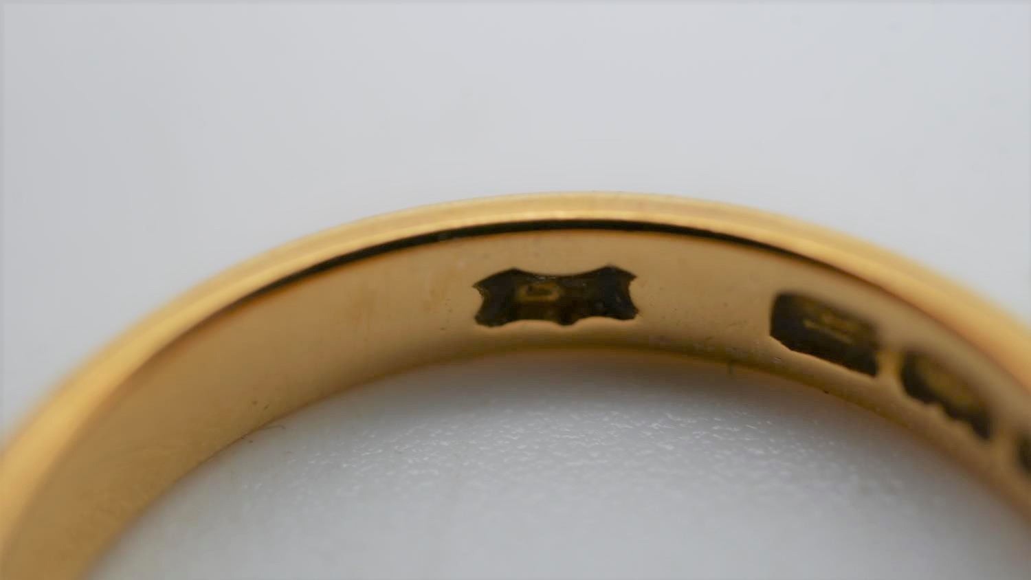 A 1920's 22 carat yellow gold D-shaped court wedding band. Hallmarked: London, 1925. Size N 1/2. - Image 6 of 6