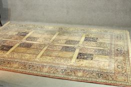 A woollen Bakhtiar style carpet with 'garden' sections decorated with trees. L.300 W.200cm.