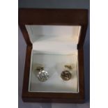 A pair of 14 carat gold vintage Cartier octagonal cufflinks with double C monogram with screw