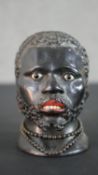 A 19th century finely carved Blackamoor inkwell, with inset glass eyes and polychromed teeth and