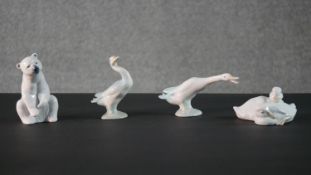 A collection of four Lladro and Nao hand painted porcelain figures. A polar bear and three geese.
