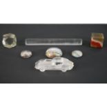 A collection of paperweights. Including a Victorian glass page magnifier and reader, a Waterford