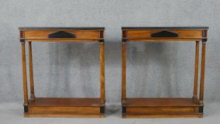 A pair of Biedermeier style console tables, with a rectangular slate marble top, on columnar legs,