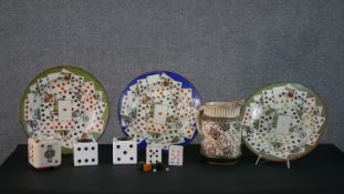 A collection of playing card and dice items. Including dice ashtrays, a large wash jug with