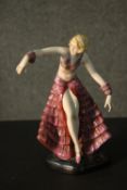 A Fasold & Stauch Bock, Wallendorf Art Deco figure of a young woman in a pink ruffle dress in