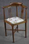 An Edwardian stained beech corner chair, with a pierced splat back, upholstered with rabbit