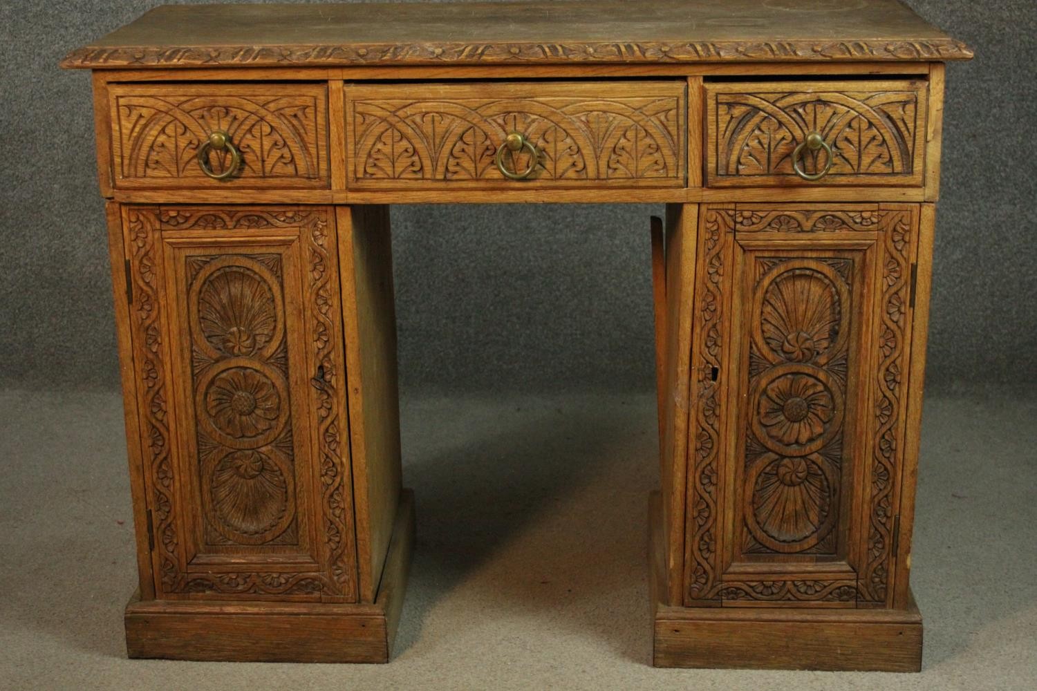 Pedestal desk, Victorian carved oak in three sections. H.77 W.103 W.48cm.