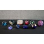 A collection of ten lamp work limited edition paperweights, various makers including Mdina and