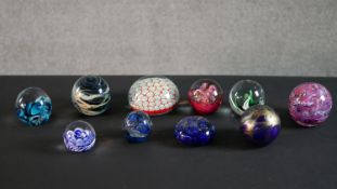 A collection of ten lamp work limited edition paperweights, various makers including Mdina and