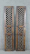 A pair of Indian teak door shutters, with a lattice design in three panels. H.185 W.38 D.4cm